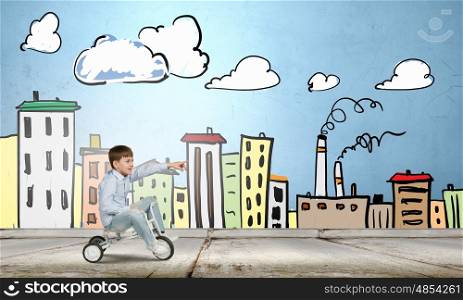 Happy childhood. Cute boy against drawn background riding three wheeled bike