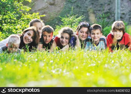 happy children group have fun outdoor in nature at suny day