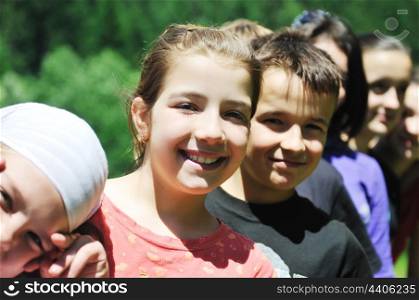 happy children group have fun outdoor in nature at suny day