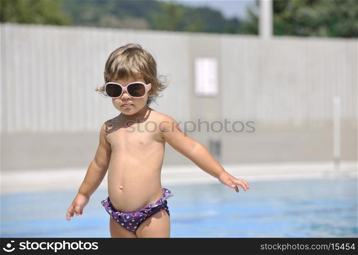 happy children have fun on swimming pool