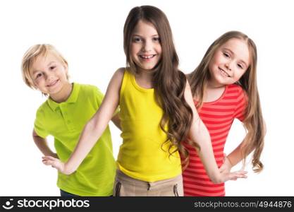 Happy children isolated on white. Happy smiling three children in colorful clothes isolated on white background