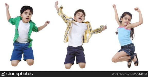 Happy children jumping over white background