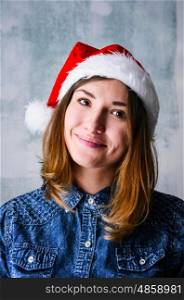 Happy Christmas woman. Christmas celebration portrait of young adult happy woman wearing Santa hat