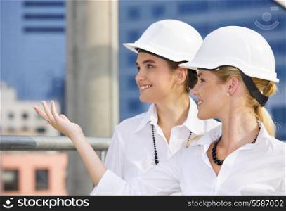 happy contractors in a front of building site