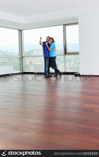 happy couple at big bright comfort apartment celebrate with glasses of champagne