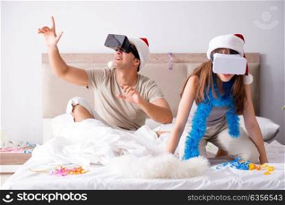 Happy couple celebrating christmas holiday in bed. The happy couple celebrating christmas holiday in bed