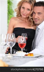 Happy couple enjoying romantic meal