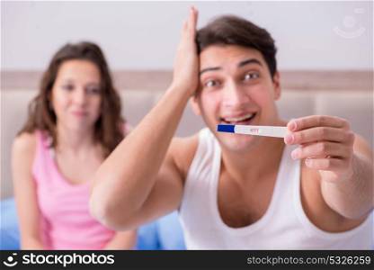 Happy couple finding out about pregnancy test results