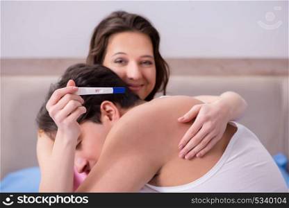 Happy couple finding out about pregnancy test results
