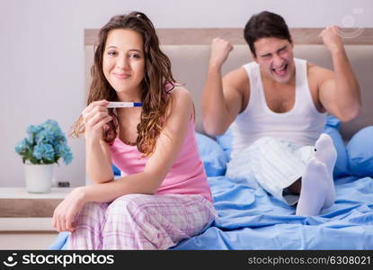 Happy couple finding out about pregnancy test results