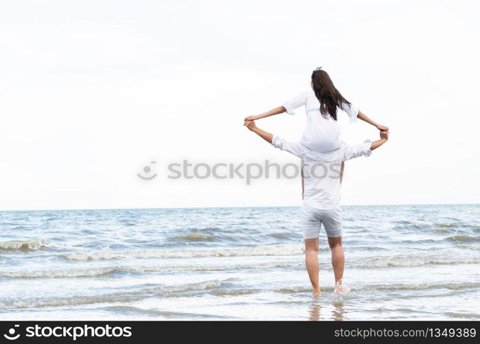 Happy couple going honeymoon travel on tropical sand beach in summer.. Couple going honeymoon on tropical beach in summer