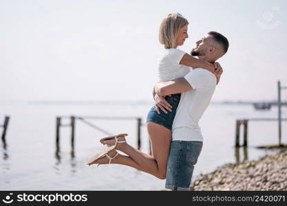 happy couple hanging out together beach