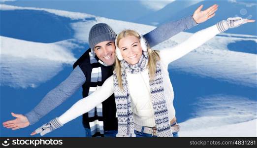 Happy couple having fun, raised arms flying hands, outdoors at winter snowy mountains, people at nature, blue wintertime landscape background, Christmas vacation holidays, love concept