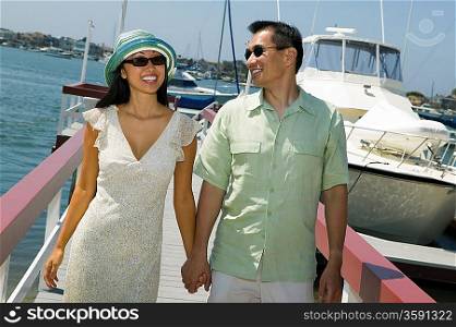 Happy Couple Holding Hands on Docks