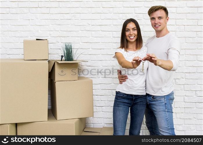happy couple holding house keys