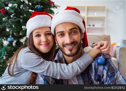 Happy couple hugging during christmas