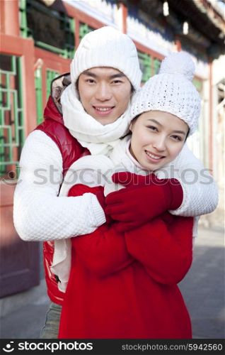 Happy couple hugging in HuTong Yard