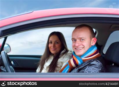 happy couple in a car