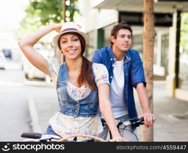 Happy couple in city with bike. Happy young couple in city with bike