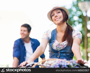 Happy couple in city with bike. Happy young couple in city with bike