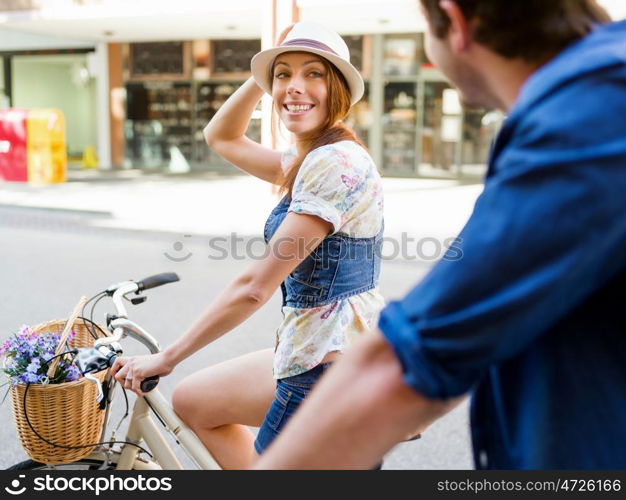 Happy couple in city with bike. Happy young couple in city with bike