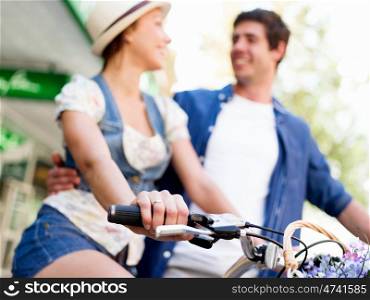 Happy couple in city with bike. Happy young couple in city with bike