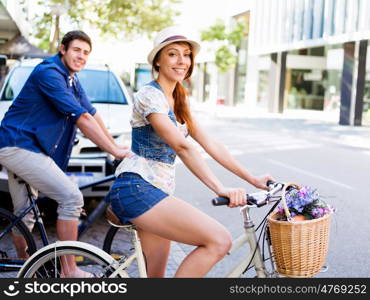 Happy couple in city with bike. Happy young couple in city with bike