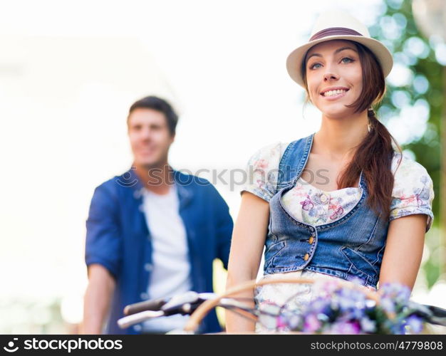 Happy couple in city with bike. Happy young couple in city with bike