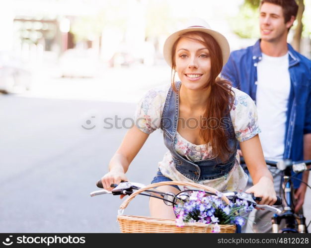 Happy couple in city with bike. Happy young couple in city with bike