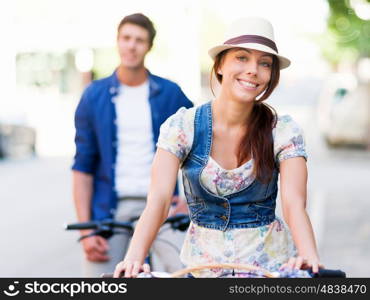 Happy couple in city with bike. Happy young couple in city with bike