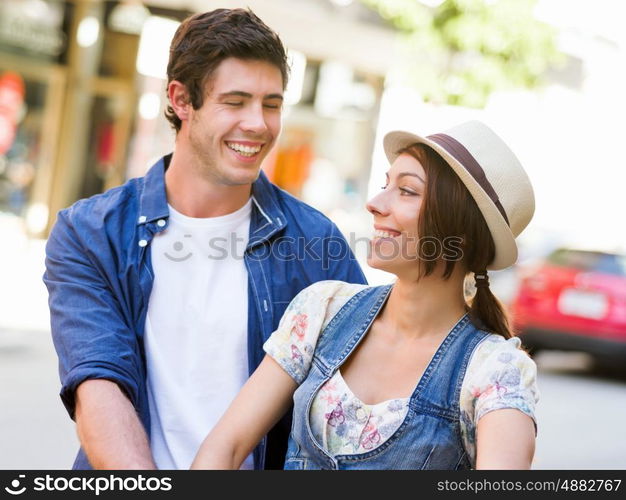 Happy couple in city with bike. Happy young couple in city with bike