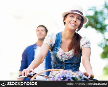 Happy couple in city with bike. Happy young couple in city with bike