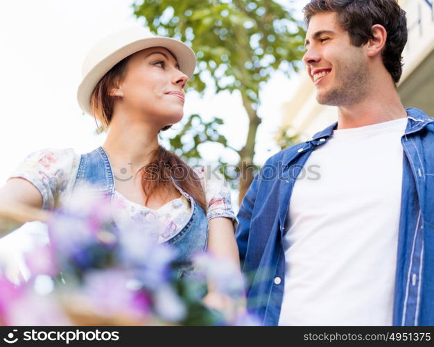 Happy couple in city with bike. Happy young couple in city with bike