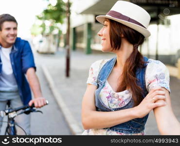 Happy couple in city with bike. Happy young couple in city with bike