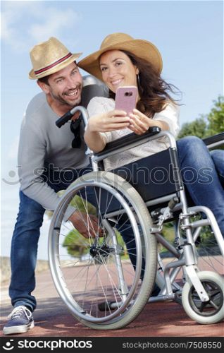 happy couple in love taking selfie in urban