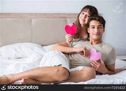 Happy couple in the bed