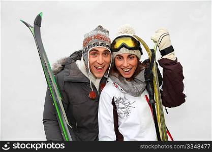 Happy couple in the mountains for ski vacation