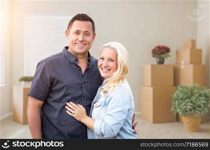 Happy Couple Inside Empty Room with Boxes.