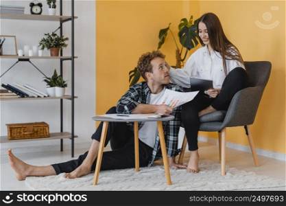 happy couple making plans redecorate household
