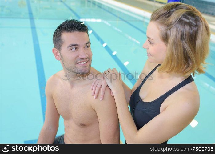 happy couple near swimming pool