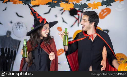 happy couple of love in costumes and makeup on a celebration of Halloween