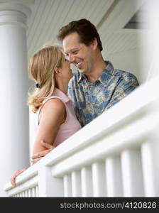 Happy Couple on Porch of Home