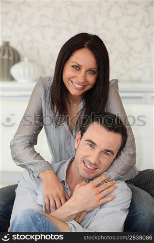 Happy couple on sofa