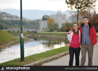 happy couple outdoor, beautiful pregnant woman with her husband