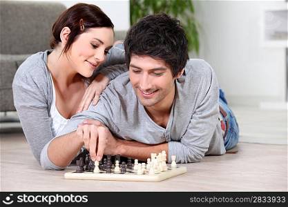 happy couple playing chess