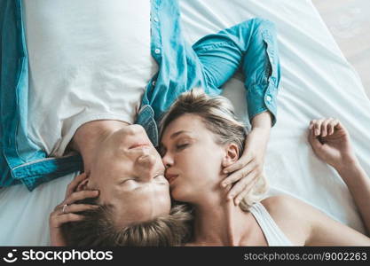 Happy Couple Playing together in the bedroom