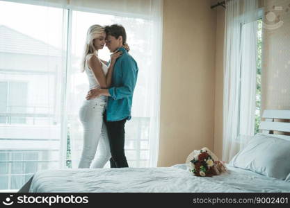 Happy Couple Playing together in the bedroom