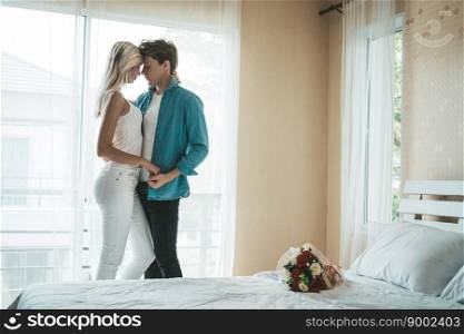 Happy Couple Playing together in the bedroom