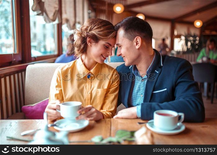 Happy couple, romantic date in restaurant. Man and woman beautiful relationship