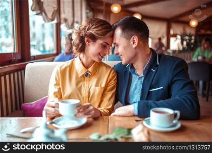 Happy couple, romantic date in restaurant. Man and woman beautiful relationship